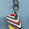 Fordite Keychain - 26.48mm x 20.55mm x 7.02mm          (2756)