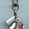 Fordite Keychain - Harley Davidson - 21.19mm x 19.06mm x 3.91mm          (2972)