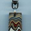 Fordite Keychain - Military Fordite - 37.12mm x 17.62mm x 6.67mm          (3103)